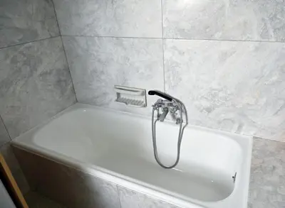 a shower in a bathroom with a white sink at Brand New! Vintage Charm, Modern Comfort in Athens