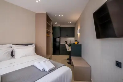 a bedroom with a bed with white towels on it at Agora Views in Athens