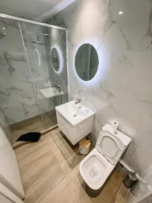 a bathroom with a toilet and a sink and a shower at Studios & Shared Roof to Acropolis in Athens