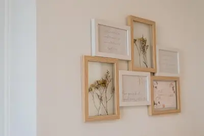 a group of four pictures on a wall with flowers at MrK Rooftop 2 in Athens