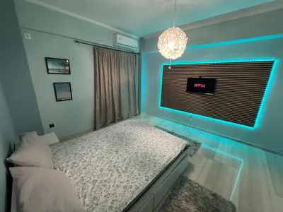 a bedroom with a bed and a blue wall at Athens station 4 min walk , two bedroom apartment in Athens