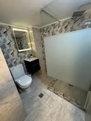 a bathroom with a toilet and a sink and a mirror at Athens station 4 min walk , two bedroom apartment in Athens