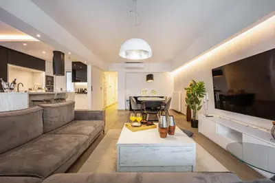 a large living room with a couch and a table at Luxury 3-bedroom Apartment Athens Nea Smirni in Athens