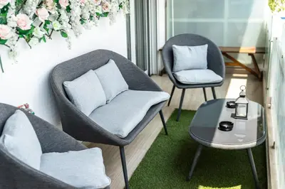 two chairs and a table in a room at Luxury 3-bedroom Apartment Athens Nea Smirni in Athens