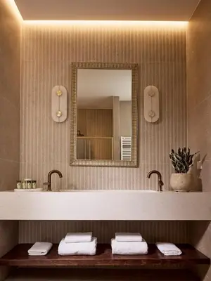 a bathroom with a sink and a mirror at Acropolis Eclectic Residence in Athens