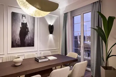 a dining room with a table and a large window at Acropolis Eclectic Residence in Athens
