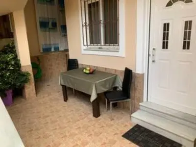 a room with a table and chairs and a white door at Modern & Lovely Apartment Downtown Near Acropolis in Athens
