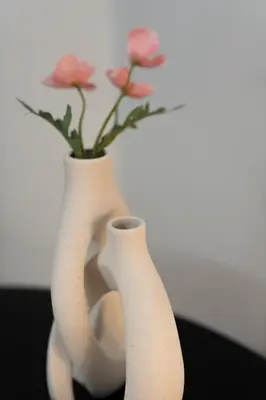 two white vases with pink flowers in them at 1BR Apt with Backyard in Plaka 10 From Acropolis in Athens
