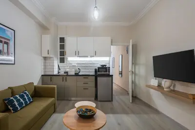 a living room with a couch and a table at 1BR Apt with Backyard in Plaka 10 From Acropolis in Athens