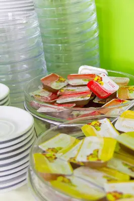 a table topped with plates and bowls of food at Athens Choice Hotel in Athens