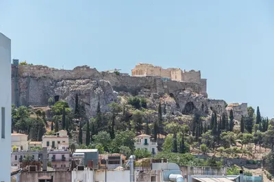 a view of the acropolis from the city of athens at Centric Romantic Studio Zen Clio, Tessera Urban Apartments in Athens