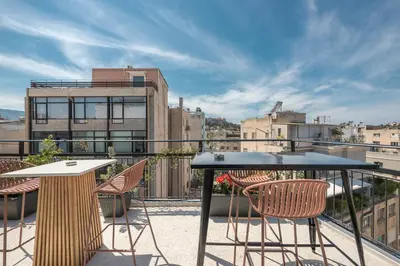 a table and chairs on a balcony with a view at Centric Romantic Studio Zen Clio, Tessera Urban Apartments in Athens