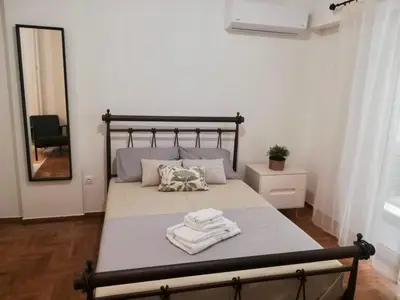 a bedroom with a bed with towels on it at Modern Studio for 2 persons in the Heart of Athens in Athens