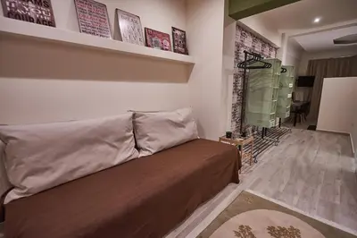 a living room with a couch in a room at Lycabettus View 2, brand-new, central, cozy studio in Athens