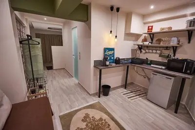 a small kitchen with a counter and a stove at Lycabettus View 2, brand-new, central, cozy studio in Athens