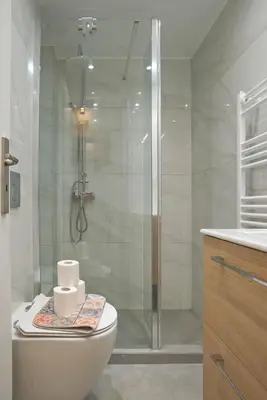 a bathroom with a toilet and a glass shower at Charming Kallithea Apt, fully Reno, Fully Equipped in Athens