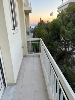 a balcony with a view of the ocean at Sea La Vie, Glyfada in Athens