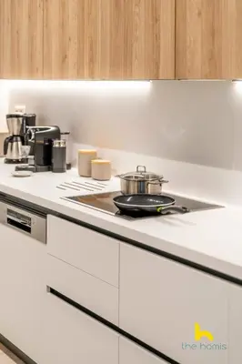 a kitchen with a stove with a pot on it at Radiant 3BR in Pireas Near Marina Zeas and Metro in Piraeus