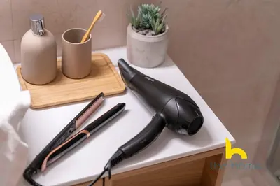 a black umbrella on a table with a cutting board at Radiant 3BR in Pireas Near Marina Zeas and Metro in Piraeus