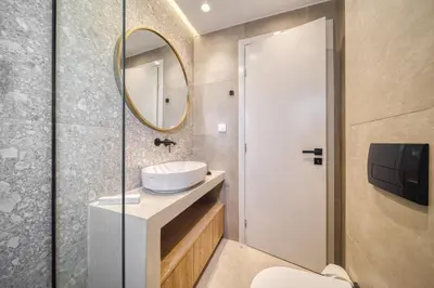 a bathroom with a sink and a mirror at Acropolis Museum Studios in Athens