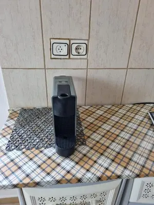 a toilet in a bathroom with two faces on the wall at DianaHub in Artemida