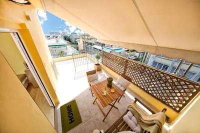 an overhead view of a balcony with a table and chairs at Island In The Sky, Acropolis and City Views! in Athens