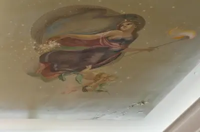 a painting of a woman on a ceiling at Piraeus Pasalimani LargeTerrace Seaview Apartment in Piraeus