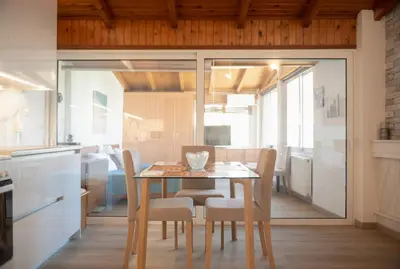 a kitchen and dining room with a table and chairs at Combination of the sea and the countryside in Vari