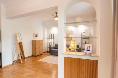a room with an archway and a living room at Athena's Escape-Your Greek base! in Athens