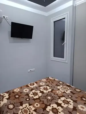 a bedroom with a bed with a tv and a mirror at Nikaia Luxury Dream in Piraeus