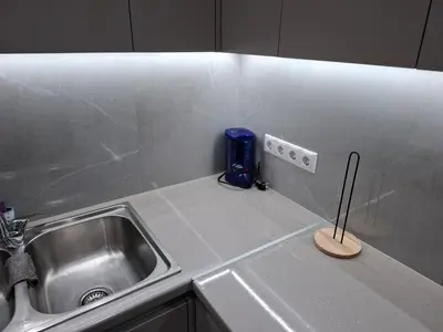 a kitchen counter with a sink and a knife at Nikaia Luxury Dream in Piraeus
