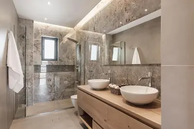 a bathroom with two white sinks on a wooden counter at Luxury 3-BD condo with 80sqm balcony in Glifada in Athens
