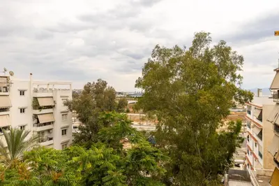 a view from the roof of a building with trees at Kallithea fresh in Athens