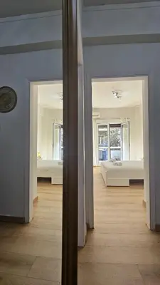 a room with a room with two beds in it at Lotus Suite Ampelokipoi in Athens