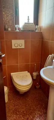 a bathroom with a toilet and a sink at Beautiful apartment in the center of Glyfada in Athens