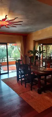 a dining room with a wooden table and chairs at Beautiful apartment in the center of Glyfada in Athens