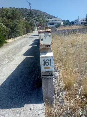 a parking meter on the side of a road at Aegean Pearl in Áyios Dhimítrios