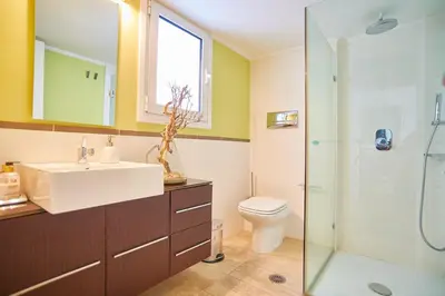 a bathroom with a sink and a toilet and a shower at Dream-Stay apartment with a spacious balcony in Athens
