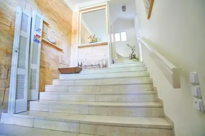 a staircase in a house with a window at Dream-Stay apartment with a spacious balcony in Athens