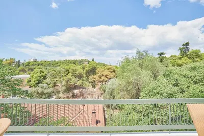 a view of a hill from a balcony at Dream-Stay apartment with a spacious balcony in Athens