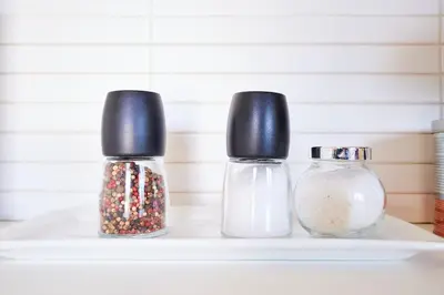 two salt and pepper shakers sitting on a shelf at Dream-Stay apartment with a spacious balcony in Athens