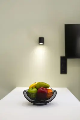 a bowl of fruit sitting on a table at Kais eleven studio in Athens