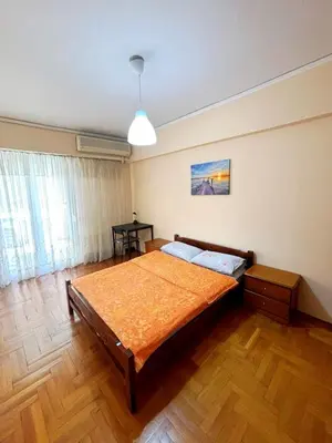 a bedroom with a large bed in a room at Imperial 2 in Athens
