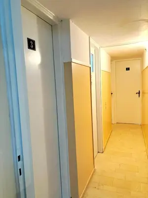 an empty hallway with a door and a hallwayngth at Imperial 2 in Athens