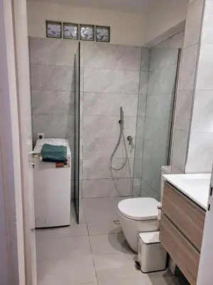 a bathroom with a shower and a toilet in it at Athens Pearl in Athens