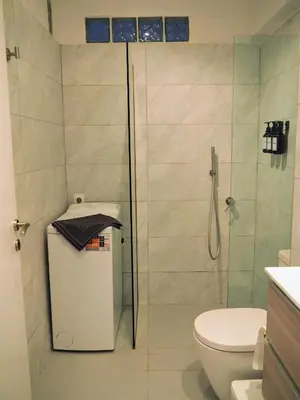 a bathroom with a shower and a toilet at Athens Pearl in Athens