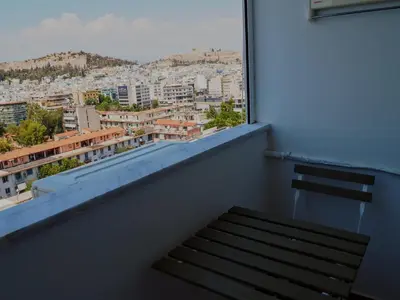 a balcony with a view of a city at Athens Pearl in Athens