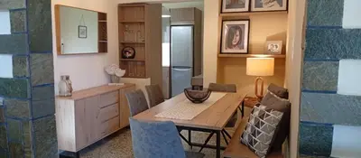 a kitchen and dining room with a table and chairs at Chara's Luxury Home in Vravrona