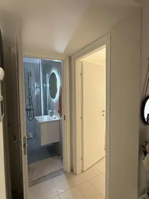a bathroom with a shower and a sink and a mirror at A nest for two in Athens in Mesochórion