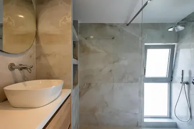 a bathroom with a sink and a shower at Athens Sky Loft in Athens